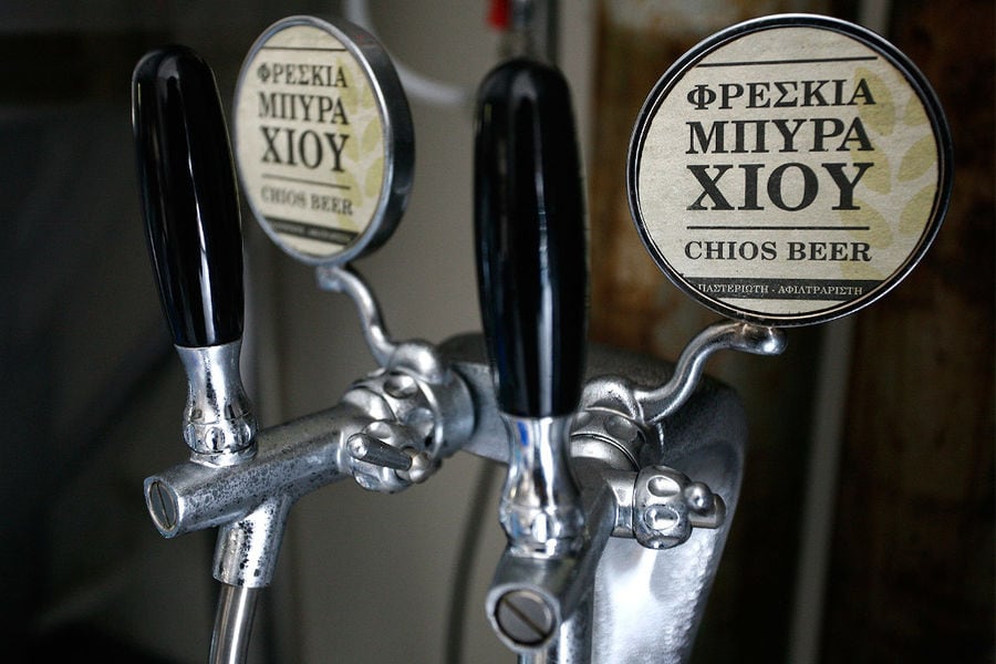 aluminum tank's handle with label that says 'CHIOS BEER'